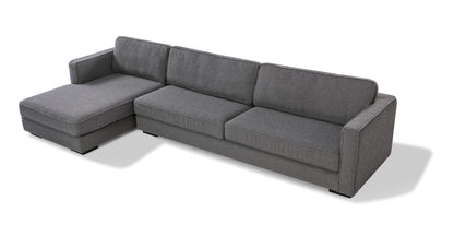 The Architect 133" Fabric Sofa Sectional Left in Blanc Boucle is a contemporary seating option with clean lines and plush cushions. It features a modern design with a left-side chaise lounge and comes in a gray color on a white background.