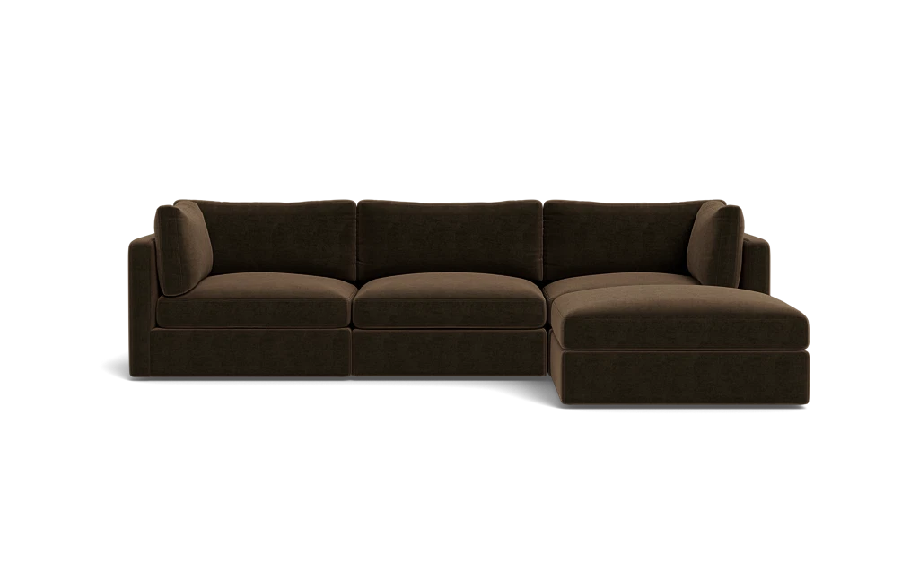 The Tatum Modular 3 Seat Chaise 106" Sectional is a dark brown piece featuring three seat cushions and a chaise lounge on the right. It boasts clean lines and a plush appearance, set against a plain black background.