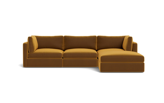 Introducing the Tatum Modular 3 Seat Chaise 106" Sectional, a modern sectional sofa in a striking mustard color. It features three seat cushions and an attached chaise lounge with clean lines, rectangular armrests, and a minimalist design set against a black background.