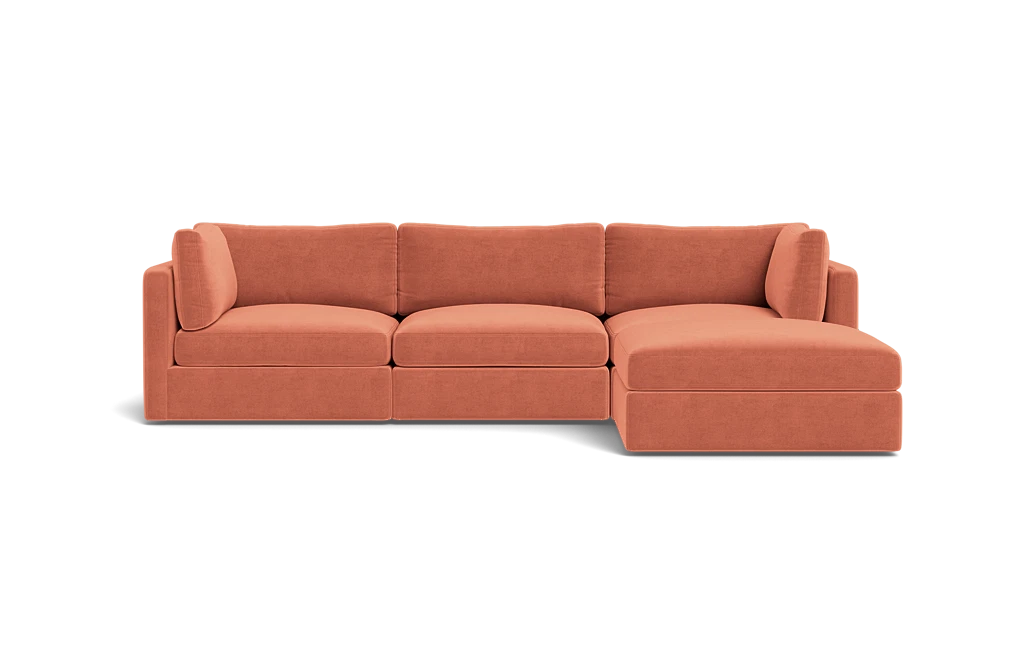 The Tatum Modular 3 Seat Chaise 106" Sectional is a contemporary, modular sofa with a right-hand chaise, featuring upholstery in warm terracotta fabric and set against a solid black background.