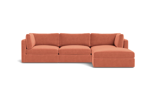 The Tatum Modular 3 Seat Chaise 106" Sectional is a contemporary, modular sofa with a right-hand chaise, featuring upholstery in warm terracotta fabric and set against a solid black background.