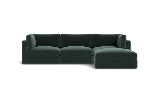 The Tatum Modular 3 Seat Chaise 106" Sectional is a dark green sofa with three seat cushions, a chaise on the right side, three back cushions, and two armrests against a solid black background.