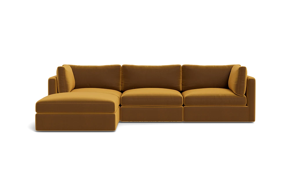 A Tatum Modular 3 Seat Chaise Sectional in mustard yellow, showcasing clean lines and plush cushions against a plain black background, features a left-side chaise for a sleek and modern design.