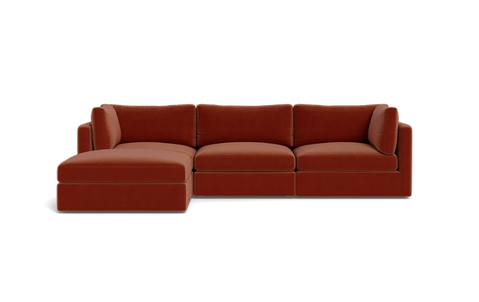 Introducing the Tatum Modular 3 Seat Chaise Sectional, a contemporary red-brown sofa with clean lines and a minimalist design, set against a solid black background. This sectional features a left-side chaise for an extended seating area.