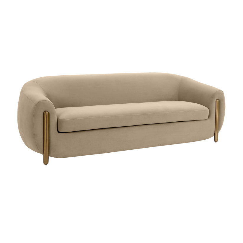 The Lina Sofa by Inspire Me! Home Decor is a modern beige sofa showcasing a smooth, curved design. It features rounded armrests and brass legs that extend up the sides, embodying a minimalist and contemporary style perfect for a stylish living room setting.