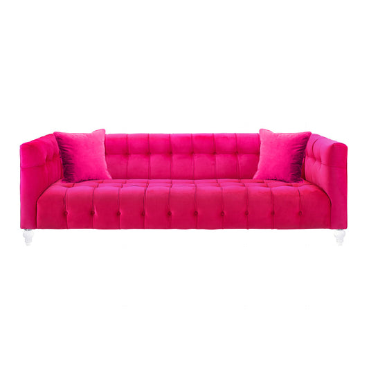 The Bea Velvet Tufted Sofa is a vibrant bright pink piece crafted with luxurious velvet and a tufted design. It comes with two matching pink cushions, showcasing a modern and elegant look with its rolled arms and white legs, all set against a plain white background.