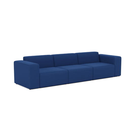 A Three-Seater Form Sectional, featuring a modern design with blue cushions and wide armrests, displayed against a plain white background.