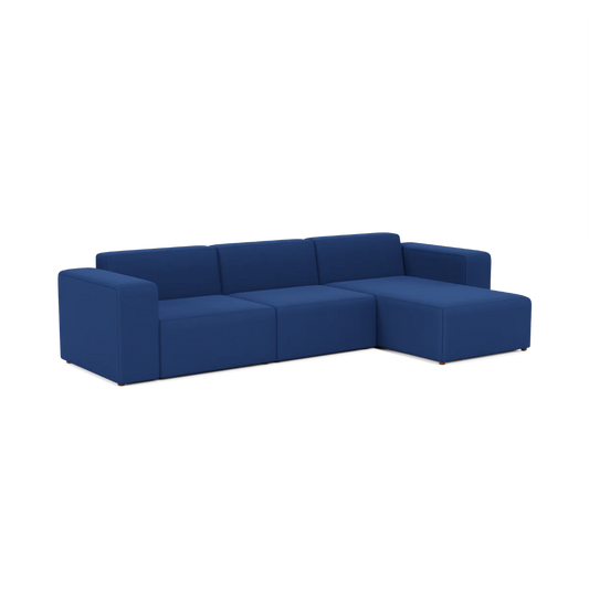 Introducing the Three-Seater Form Sectional, a contemporary blue sectional sofa featuring three seats and a right-side chaise lounge. It boasts a minimalist design with sleek square armrests, beautifully displayed against a white background.