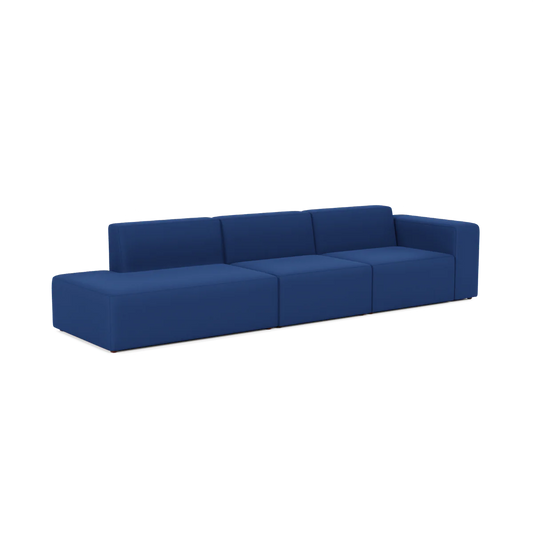 The Three-Seater Form Sectional is a contemporary blue modular sofa with a minimalist design, consisting of three parts and low armrests on each end, displayed against a white background.