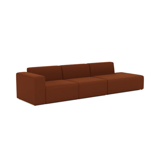 The Three-Seater Form Sectional is a modern, low-profile brown sofa featuring straight lines and three detached cushions. With its minimalist design and absence of visible legs, it exudes a sleek, contemporary aesthetic.