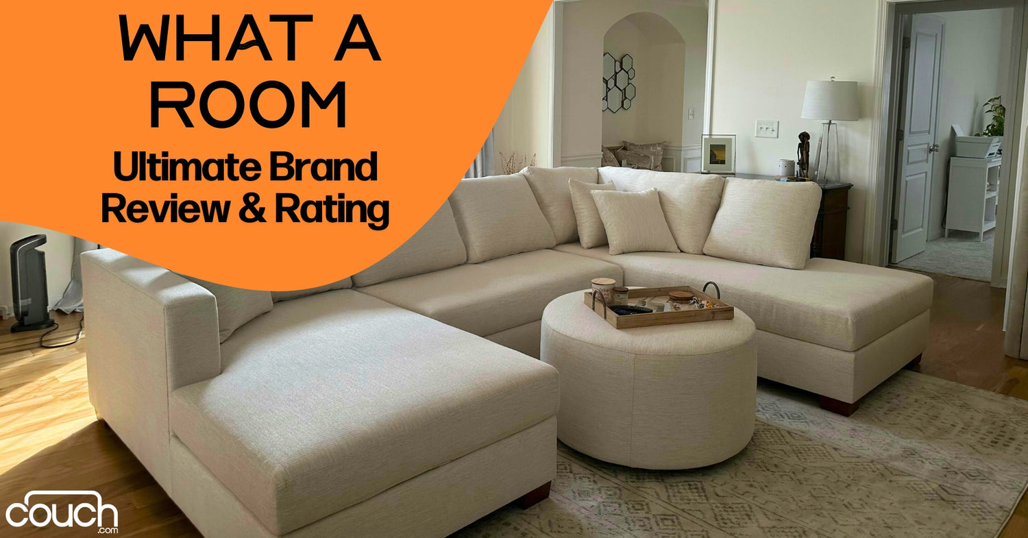 A spacious living room features an L-shaped cream sectional sofa with a round ottoman. An orange banner in the top left corner reads "WHAT A ROOM: Ultimate Brand Review & Rating," with the "couch" logo in the bottom left corner.