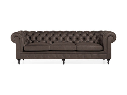 The Wessex Leather Sofa is a dark brown Chesterfield with deep button tufting and rolled arms. It features three cushions, studded detailing at the front, and six black legs, exuding a classic and elegant style.