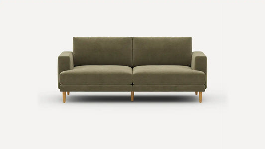 The Ember Mid-Century Modern 75" Sofa is a green sofa with a minimalist design, featuring two cushioned seats, straight armrests, and wooden legs, set against a neutral background.