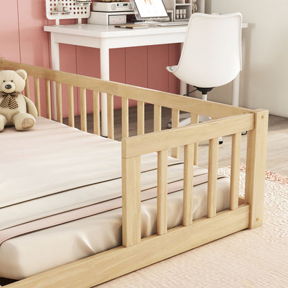 A Double Floor Bed With Fence and Guardrails sits next to a pink and white desk with a white chair, creating a cozy ambiance as soft natural light filters into the room.