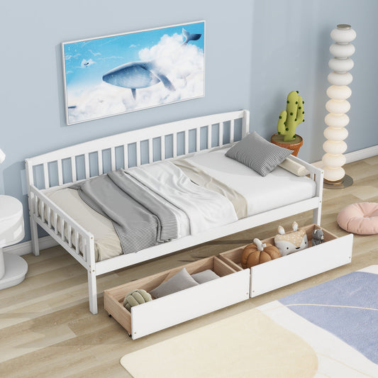 A minimalist bedroom showcases a Pine Wood Daybed with two storage drawers, highlighted by gray and white bedding. Soft toys fill the drawers, while the room includes a cactus-shaped lamp, a tall spiral lamp, and wall art of a whale in the clouds.