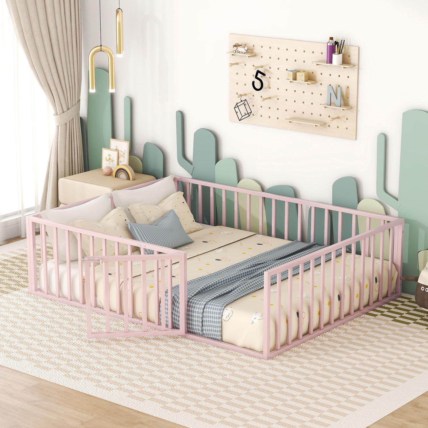 A baby room includes a soft playpen with a pink frame and patterned bedding, complemented by green and beige accent walls. A wooden pegboard adds decor, while a large window with beige curtains fills the space with natural light. The area also features a black metal floor bed frame with fence and door.