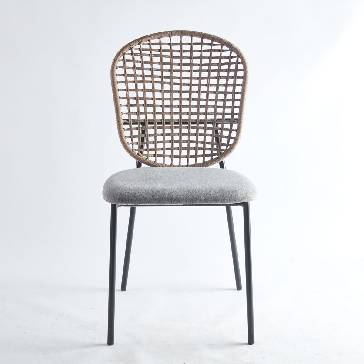 A chair from the 5 Piece Dining Set featuring a round woven rattan backrest, cushioned light gray seat, and slim black metal legs, set against a plain white background.