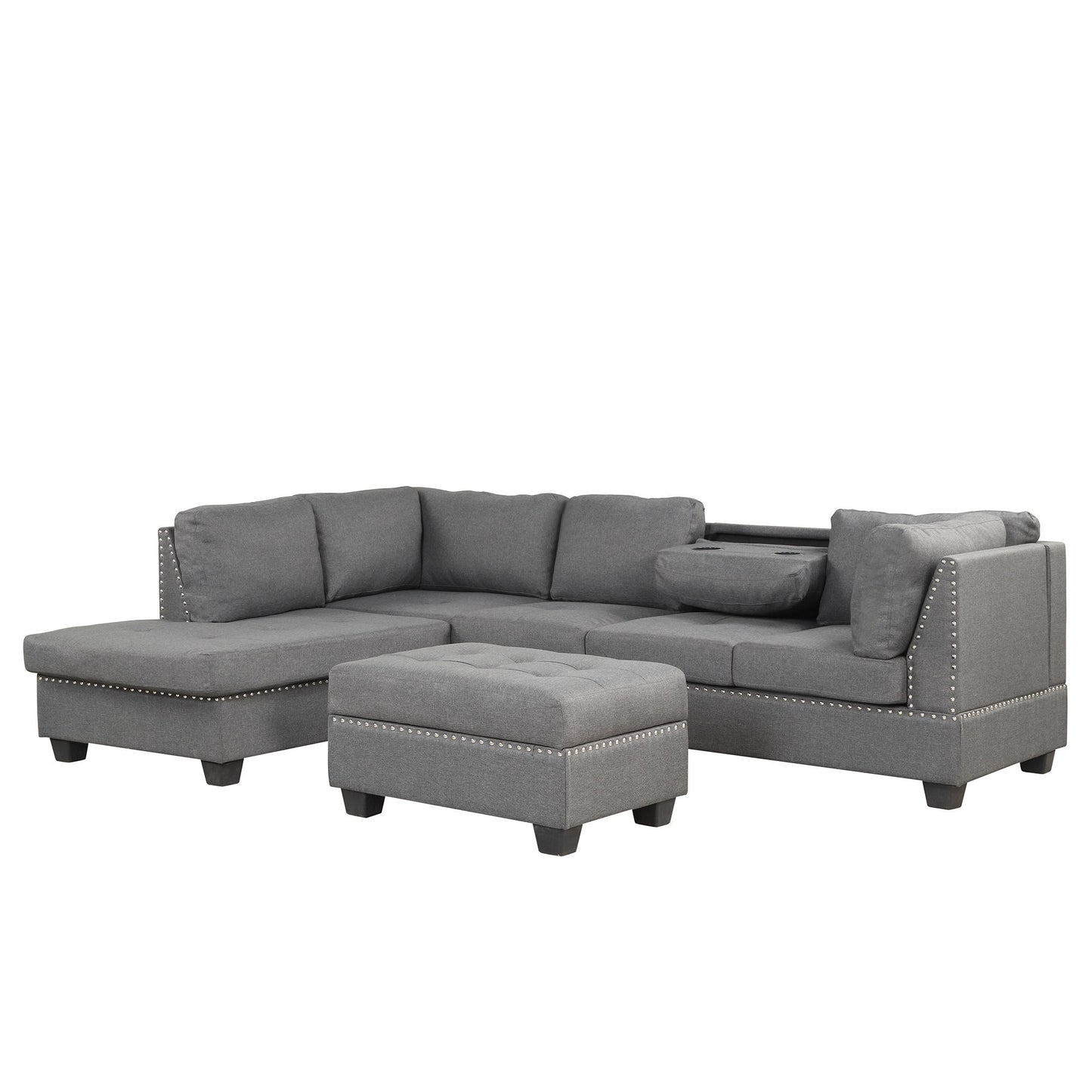 The Reversible Sectional Sofa is a grey L-shape couch featuring tufted cushions, studded detailing, a left-side chaise, and a right-side built-in cup holder. It includes a matching storage ottoman designed for small or large spaces and dorms.