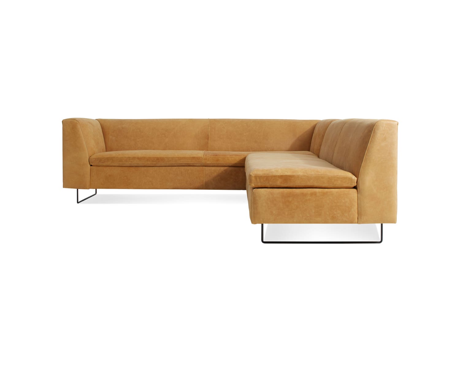 The Bonnie and Clyde Sectional Sofa is a modern L-shaped piece, crafted from tan leather with sleek black metal legs. It boasts a minimalist design and a comfortable backrest, showcased against a plain white background.