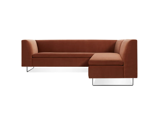 The Bonnie and Clyde Sectional Sofa is a contemporary brown L-shaped piece featuring clean lines and metal legs, presented against a plain white background.