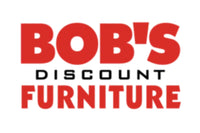 Image shows the logo of Bob's Discount Furniture. The text "Bob's" is in large, bold, red letters, "Discount" is in smaller, black letters, and "Furniture" is in large, bold, red letters beneath the other text. The background is white.