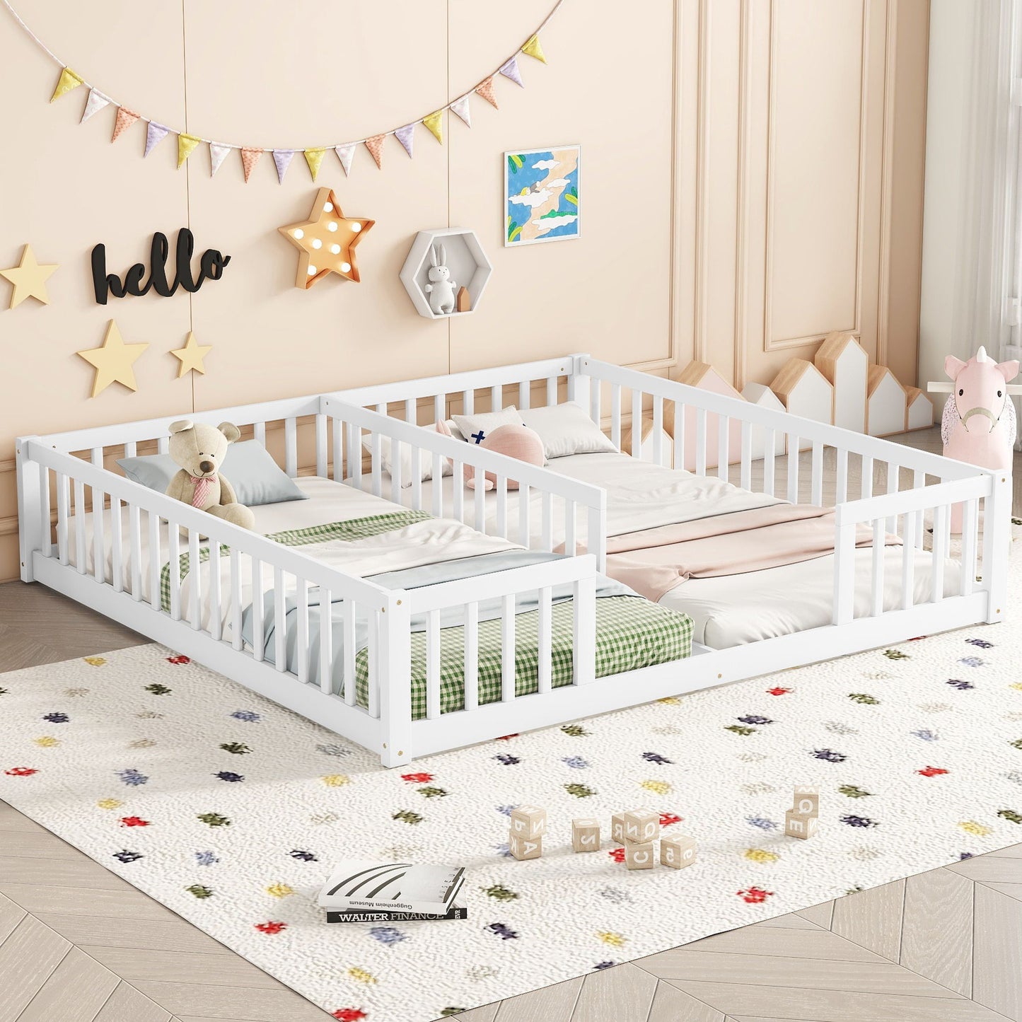 A children's bedroom features a Double Floor Bed With Fence in white, adorned with green and pink bedding and stuffed animals. Decor includes a banner, star lights, and a "hello" sign. A colorful dotted rug covers the floor.