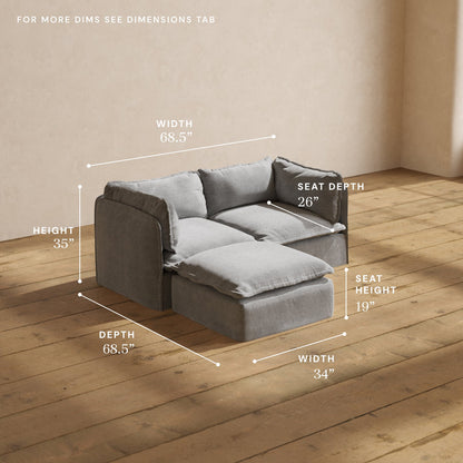 A Modular Performance 2-Seater Sectional in gray, accompanied by an ottoman, is set on a wooden floor against a light brown wall. The image displays the sofa's dimensions: width 68.5", height 35", depth 68.5", seat depth 26", seat height 19", and the ottoman's width of 34".