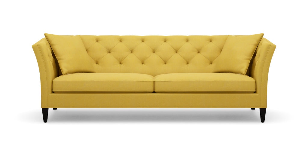 The Shelton 98" Sofa, with its bright yellow upholstery, button-tufted backrest and cushions, sloped arms, and black legs, is set against a plain white background.