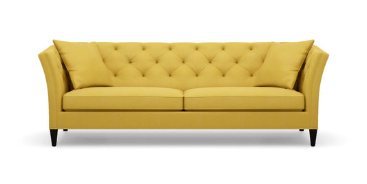 The Shelton 98" Sofa, with its bright yellow upholstery, button-tufted backrest and cushions, sloped arms, and black legs, is set against a plain white background.