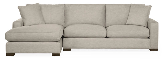 The Metro Sofas with Chaise is a light gray sectional featuring a left-side chaise lounge, modern design, three back cushions, and square armrests. It sits on short, dark wooden legs for an elevated look.