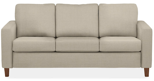 The Berin Day & Night Sleeper Sofa is a beige three-seater with wooden legs and rectangular cushions.