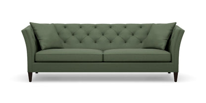 The Shelton 98" Sofa is a green, mid-century modern piece featuring a tufted backrest and angled arms. It includes two large cushions and rests on four dark wooden legs.