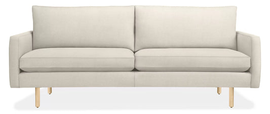 The 86" Jasper Sofa features a sleek and minimalist design, showcasing a light beige hue, two cushions, and oak wooden legs. It is viewed from the front in a modern style.