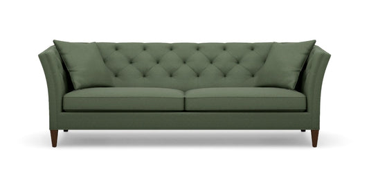 Introducing the Shelton 98" Sofa: This green, tufted sofa includes two seat cushions and two back pillows. It showcases a modern design with tall, angled armrests and tapered wooden legs.