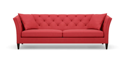 Introducing the Shelton 98" Sofa: a stunning red tufted design complete with two cushions, flared arms, and dark wooden legs, all showcased against a plain white background.