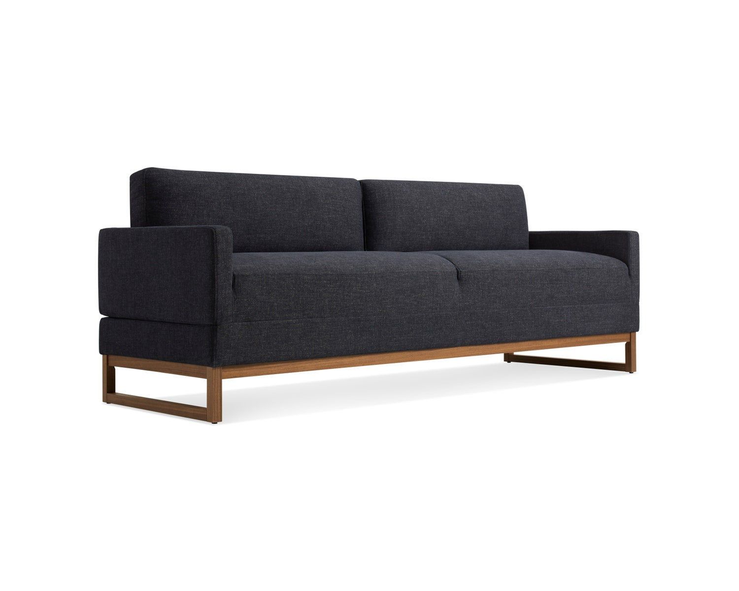 A modern black sofa with block-style cushions and armrests, featuring a minimalist design. It has a wooden base and legs, and is set against a plain white background.