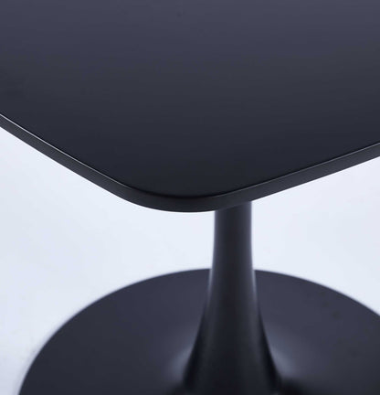 This close-up showcases the modern black MDF top of the 5 Pieces Dining Set Table, featuring a smooth, polished surface on its round-based pedestal design for 4-6 people.