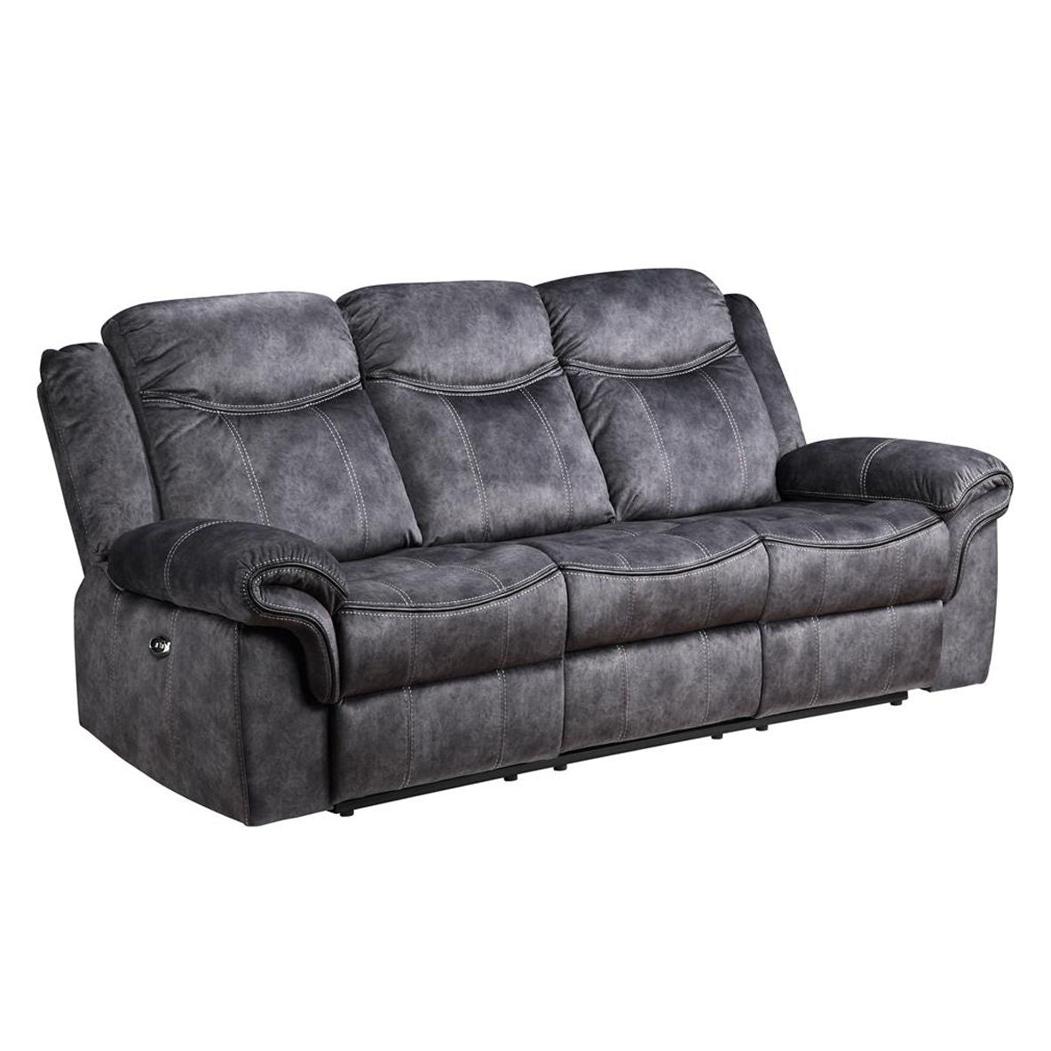 The Jimny - Domino Power Reclining Sofa is a dark gray, three-seat sofa featuring cushioned armrests and backrests. Its sleek design, visible stitching, and modern look make it ideal for a cozy living room setting.