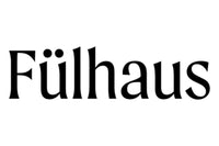 The image shows the word "F√ºlhaus" written in a bold, serif typeface. The letter "√º" is styled with an umlaut, and the overall design is clean and simple on a white background.