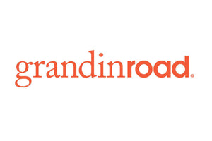 The image shows the logo for Grandin Road, where the text "grandinroad" is written in a bold, orange font against a white background.