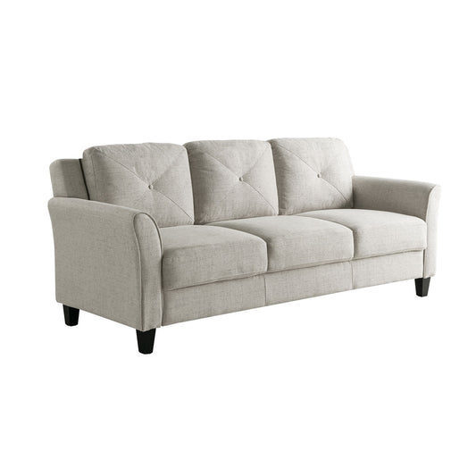 Introducing the iLounge Harvard Microfiber Sofa: a neutral-colored, three-seater masterpiece featuring tufted back cushions and gently curved armrests. Its minimalist design is complemented by sleek black wooden legs, making it an ideal addition to any modern living room.