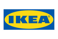 The image displays the IKEA logo, which consists of the brand name "IKEA" in bold blue letters centered within a yellow oval. This yellow oval is set against a rectangular blue background. IKEA is a globally recognized furniture and home goods retailer.