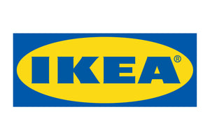 The image displays the IKEA logo, which consists of the brand name "IKEA" in bold blue letters centered within a yellow oval. This yellow oval is set against a rectangular blue background. IKEA is a globally recognized furniture and home goods retailer.