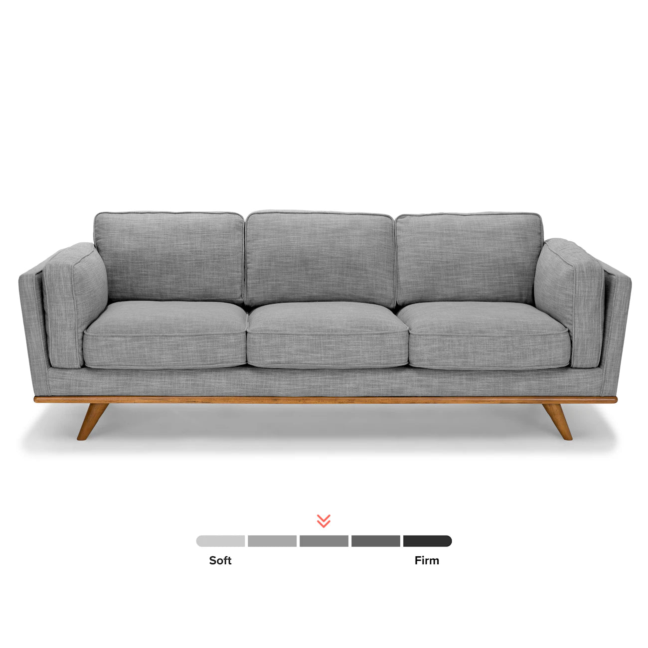 Introducing the Timber 90 Leather Sofa Charme Tan: a modern, three-seater sofa in grey, featuring a wooden frame and angled legs. The firmness level is perfectly balanced with the indicator positioned midway between soft and firm.