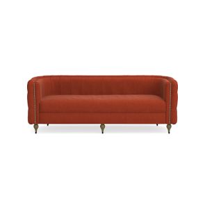 The Soho Sofa is a plush piece in orange velvet, featuring a curved back and brass-tipped legs, all set against a plain white background. With its classic design, tufted details, and elegant silhouette, it's the perfect addition to a stylish living room.