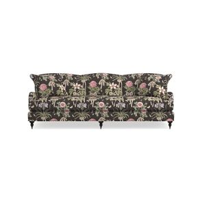 The Sanderson x Giles Deacon Bedford 87" Sofa showcases a floral pattern with a black background, accented by pink and green flowers and leaves. It includes three cushions and is supported by wooden legs, all set against a plain white backdrop.