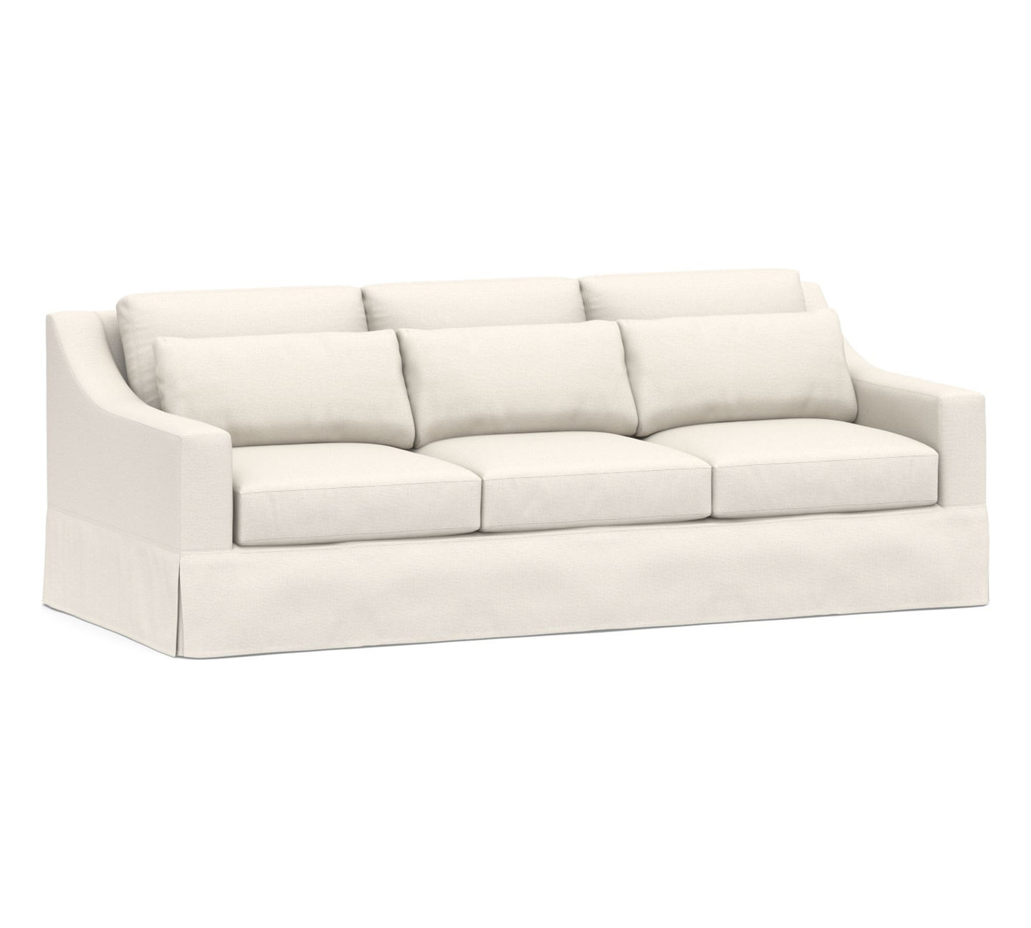 The York Slope Arm Deep Slipcovered Sofa is a cream-colored, three-seater with plush cushions and a skirted base, featuring a modern and elegant design suitable for a contemporary living space.