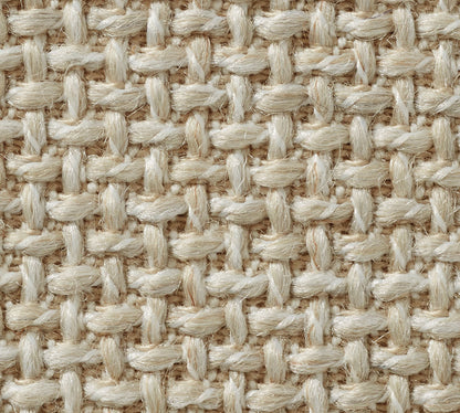 Close-up of the York Slope Arm Deep Slipcovered Sofa, showcasing its textured beige woven fabric with a crisscross pattern. The interlaced fibers create a sturdy and natural-looking surface.