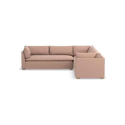 The Laguna 3-Piece L-Shape Loveseat Sectional in beige features clean lines and plush cushions. It boasts a modern design with a low backrest and square arms, supported by small, sturdy legs against a white background.