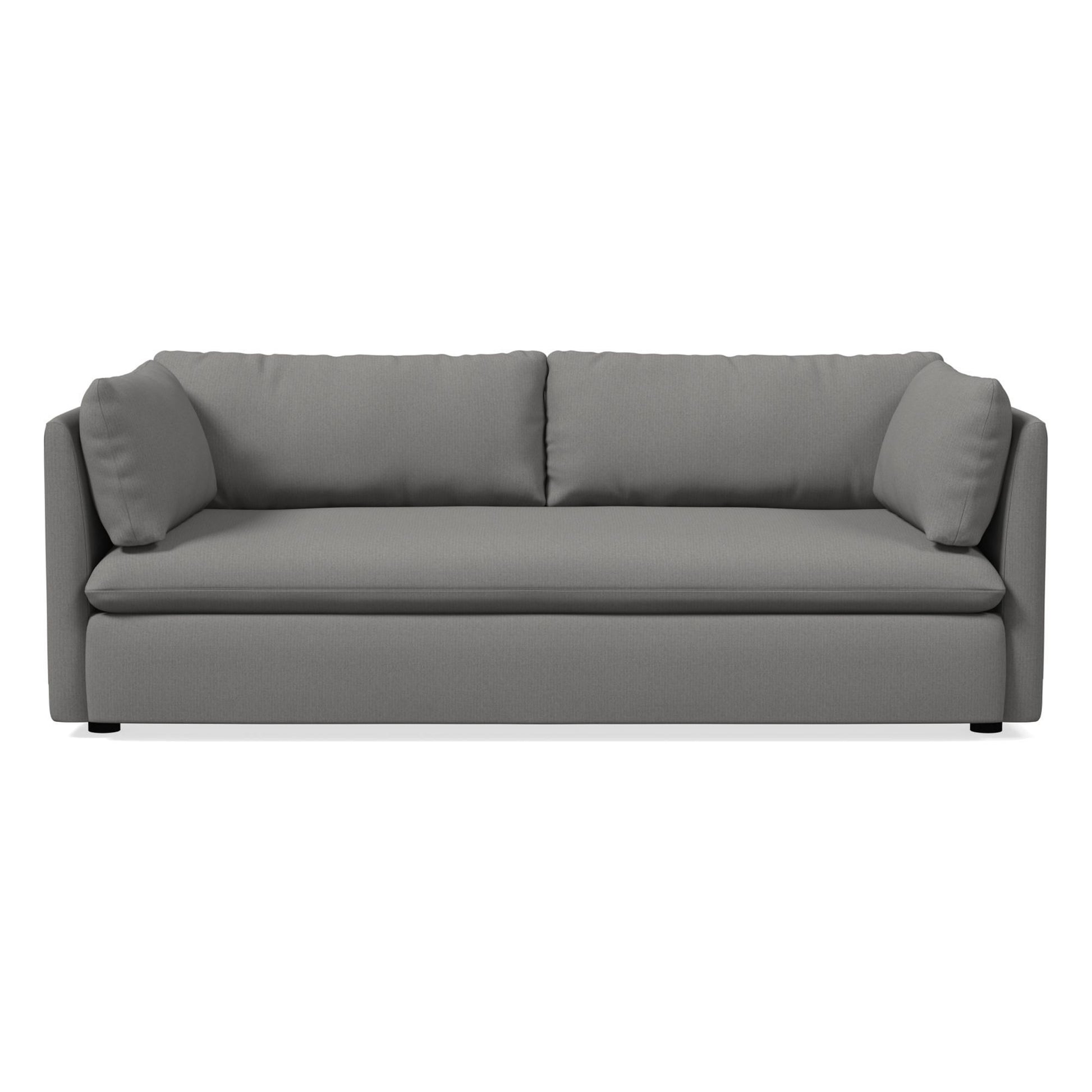 Introducing the Shelter Sleeper Sofa, a contemporary gray piece with plush cushions and a sleek, minimalist design. It includes two large back cushions and angled armrests, providing a comfortable and stylish seating solution. The sofa sits on a flat base supported by small black legs.